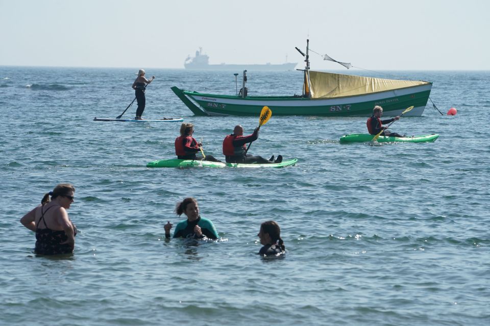 People enjoying the hot weather in Cullercoats Bay, Tyne and Wear, on Wednesday morning 