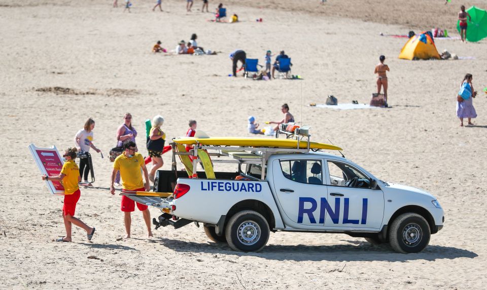 Lifeguards on Crosby Beach put out warning signs today