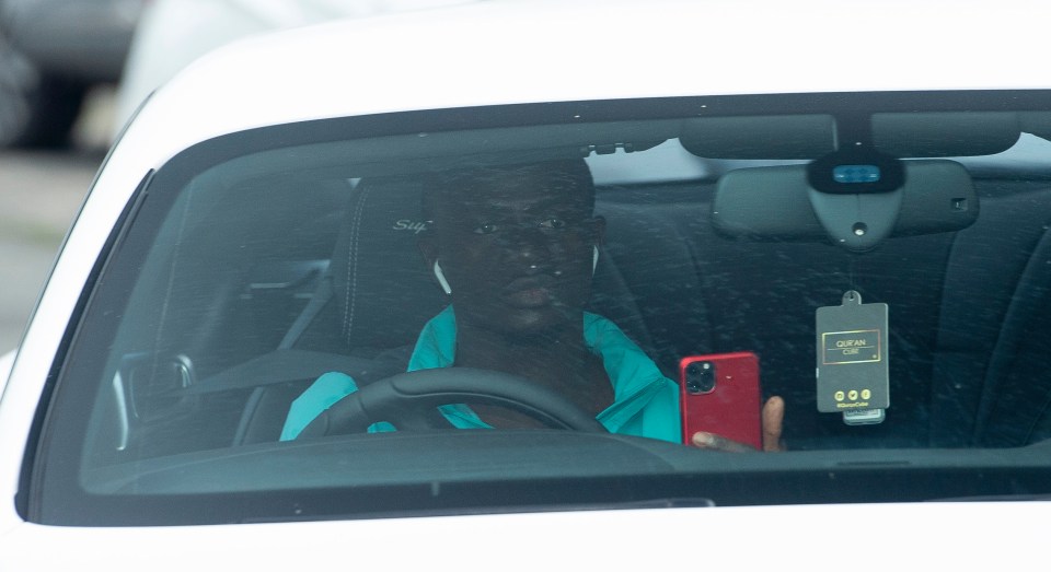 The winger in his white £150,000 Bentley
