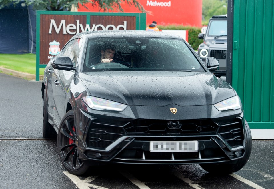 Andy Robertson also arrives for the training session in a Lamborghini