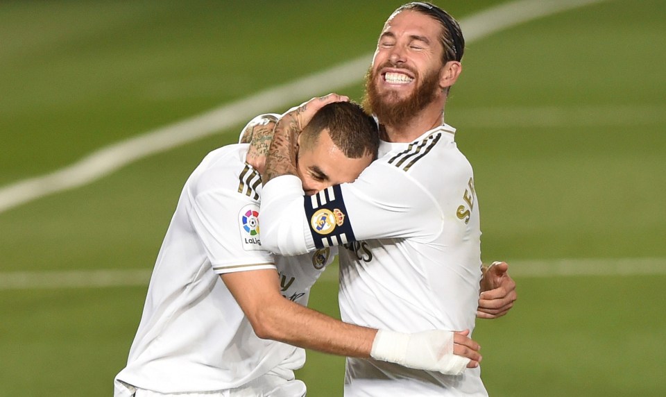 Ramos and Benzema celebrate after their retaken penalty is scored