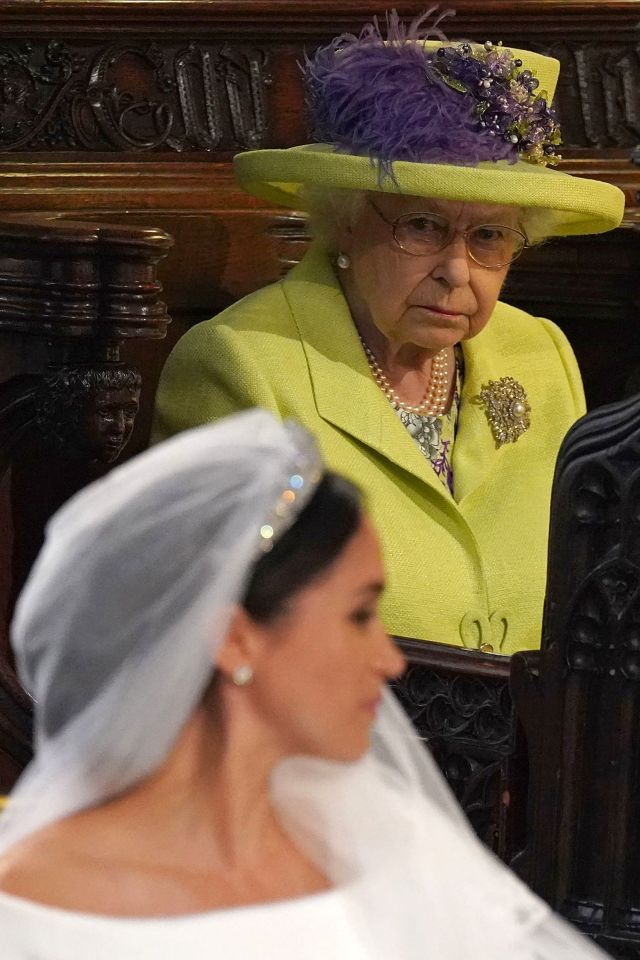 The Queen glances towards Meghan Markle during her wedding ceremony