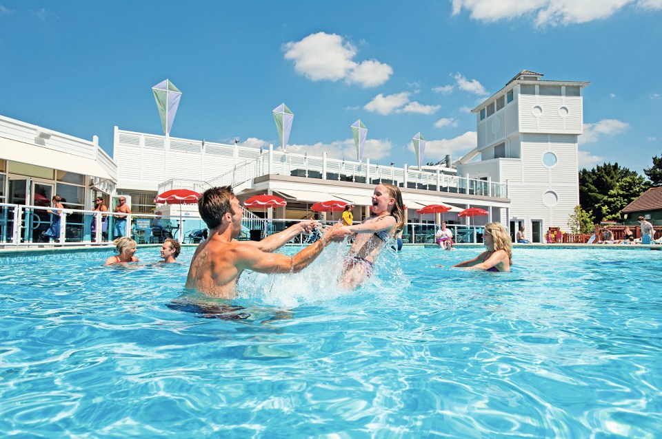 The outdoor pool is heated, framed by a sun terrace with loungers for those relaxing sunny afternoons