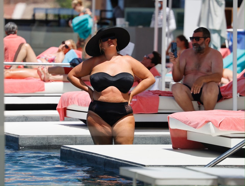 She cooled off in the glittering swimming pool