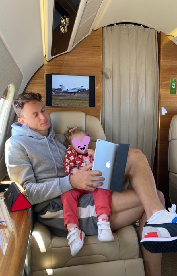 The Serbina midfielder held his daughter on board the private jet