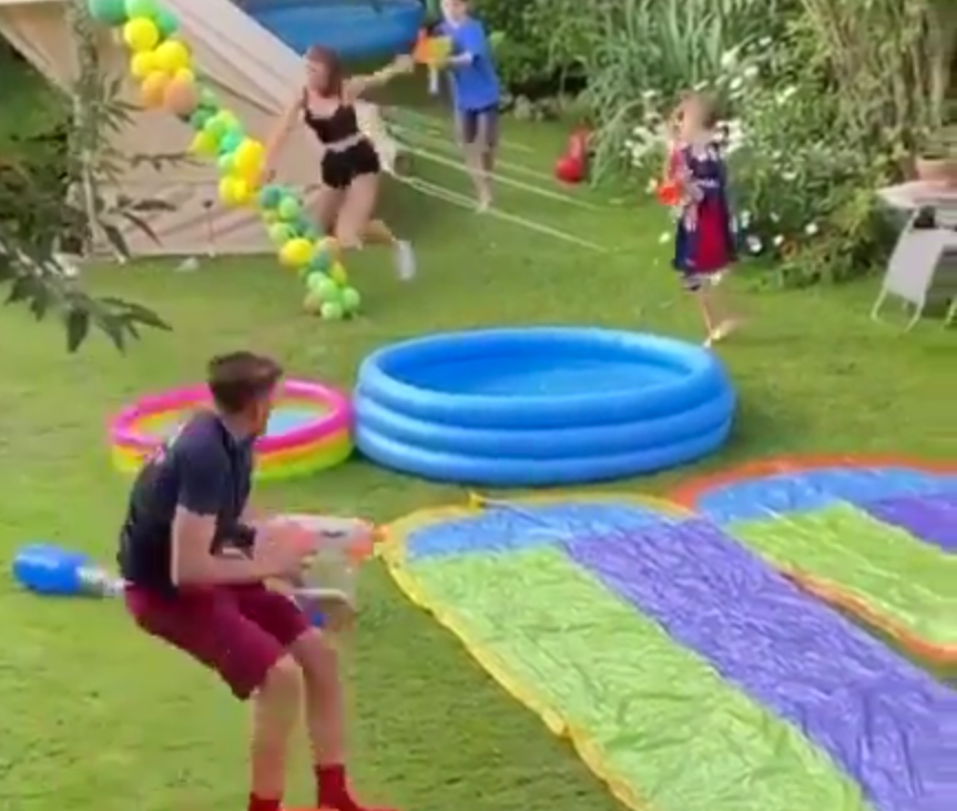 Roman got involved in an epic water fight in Kate's backgarden