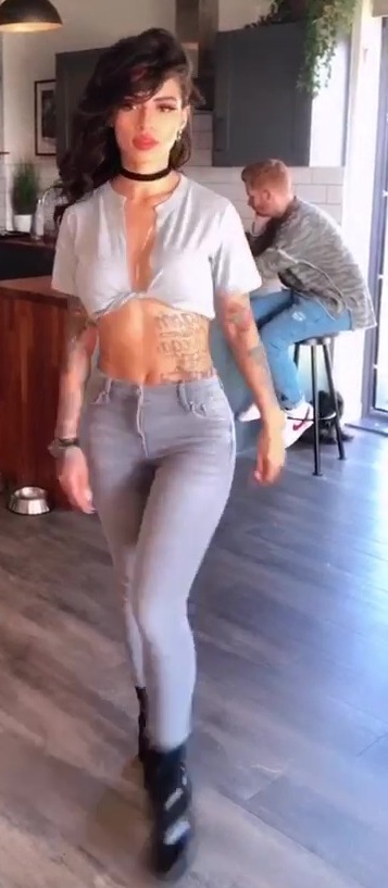 Luisa dances around Neil's flat