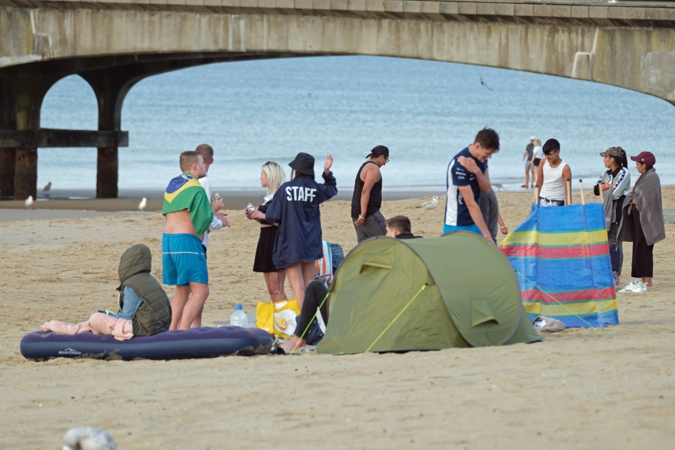 Some Brits even camped out overnight on the sand to reserve their spot