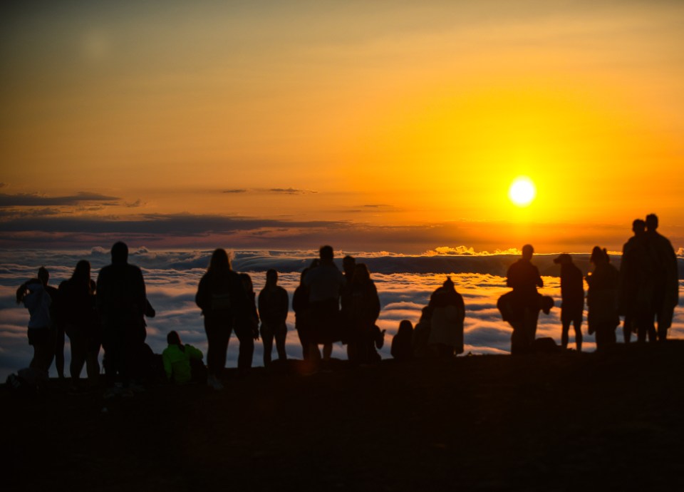 Walkers enjoyed the morning sunrise from the summit of Pen-y-Fan in the Brecon Beacons on Saturday