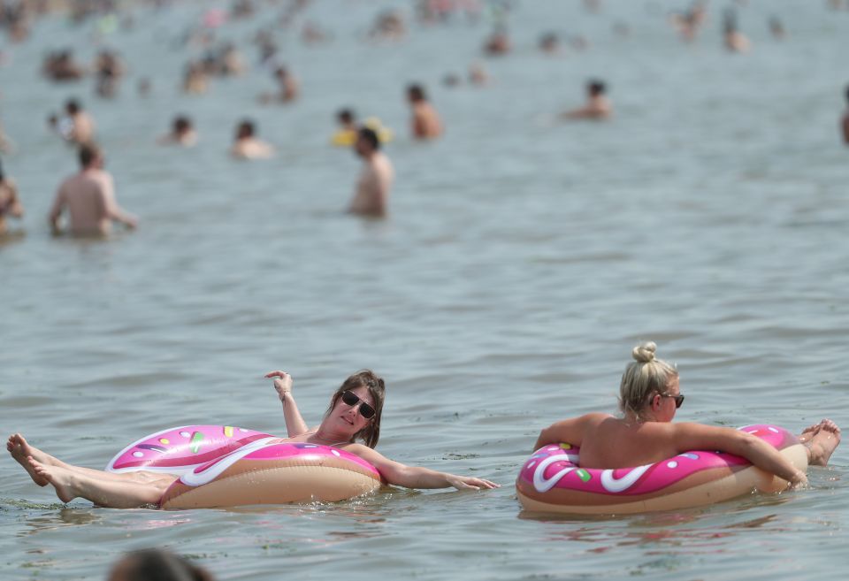 Pals cool off in the sea at Southend