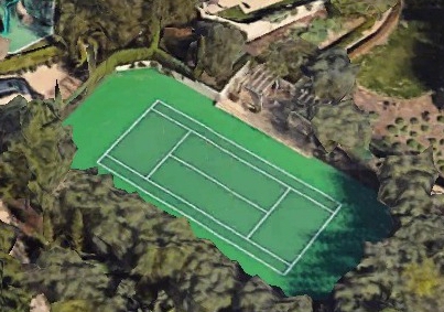 The outside area of the property also has a tennis court