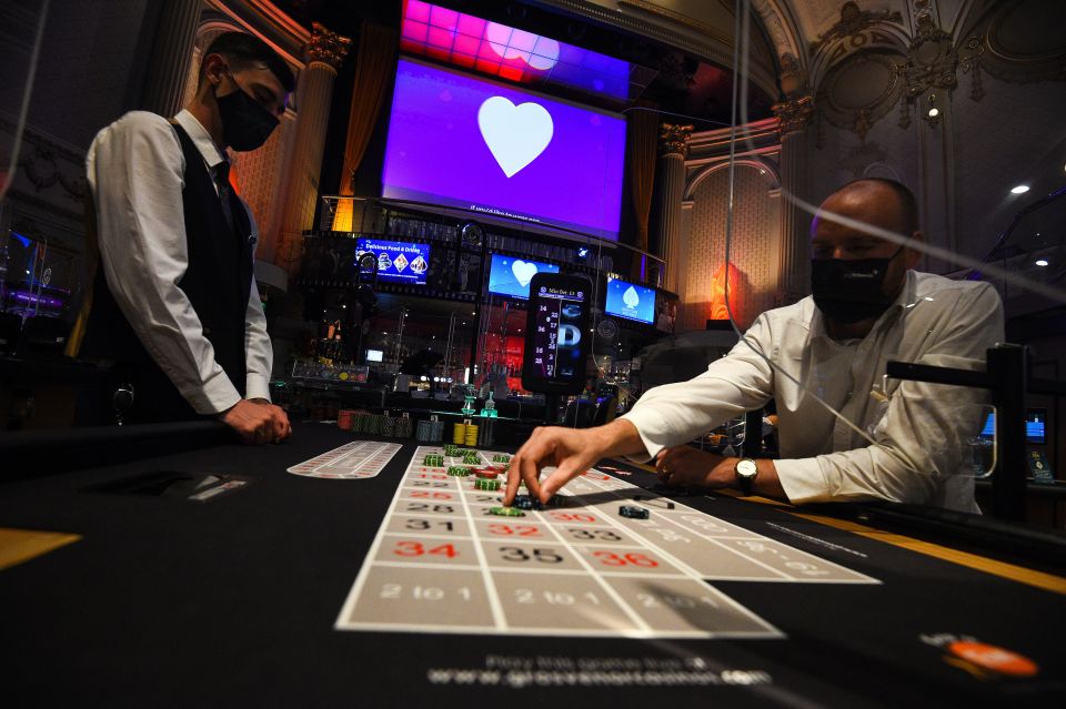 Staff wearing PPE run through a game of roulette at The Rialto casino in central London as they prepare for reopen