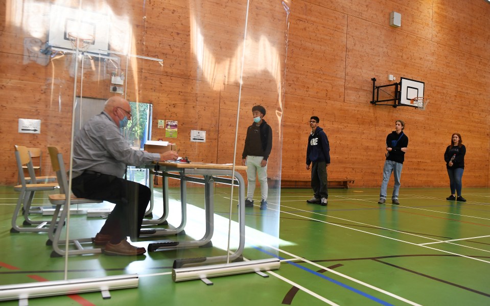 Secondary school students at Kingsdale Foundation school in south London waited in line for their results, with Covid measures in place
