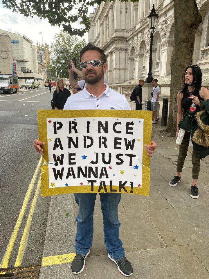  A protester held up a sign which read 'Prince Andrew we just wanna talk'