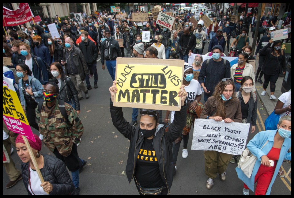Demonstrators held up 'Black Lives Matter' placards