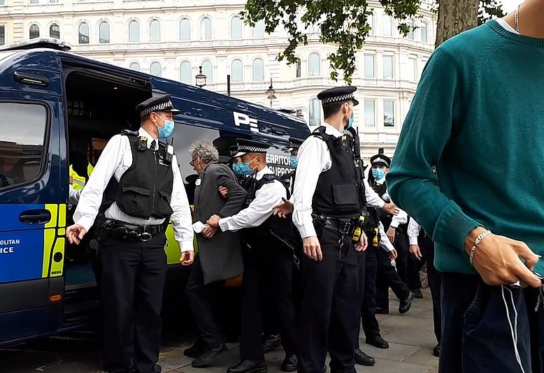 Corbyn was seen being put in a police van