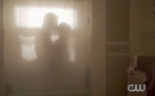 Riverdale characters Veronica Lodge (Camila Mendes) and Archie Andrews (KJ Apa) share a kiss in the shower