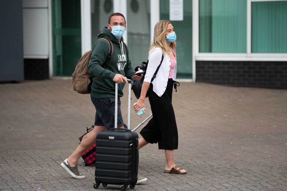 Passengers leave Cardiff Airport after their Ryanair flight from Faro, Portugal