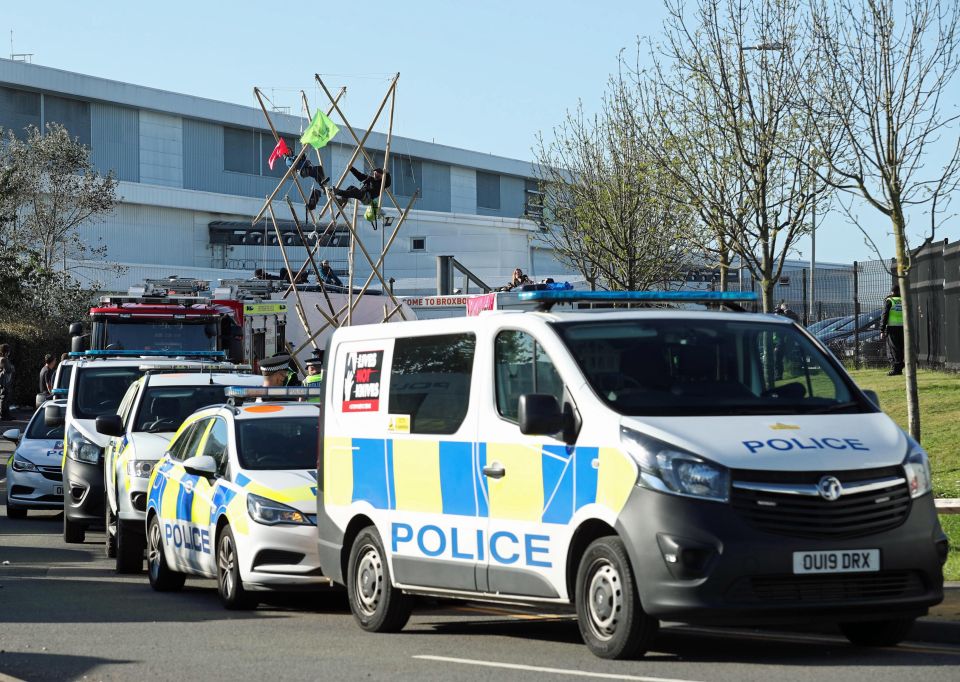 Police are seen outside the printing works at Broxbourne, Hertfordshire as protesters continue to block roads today
