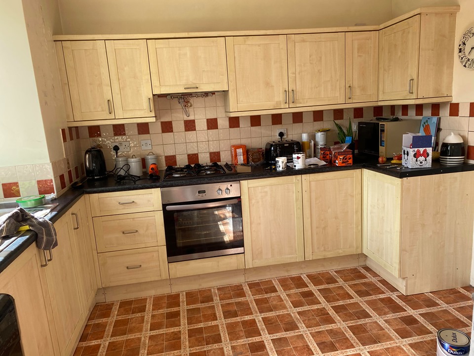Grace spent three weeks working on the kitchen transformation. Pictured before the Frenchic makeover