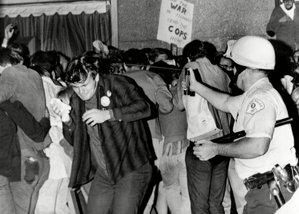 Cops maced protestors and beat them with truncheons in scenes that shocked America