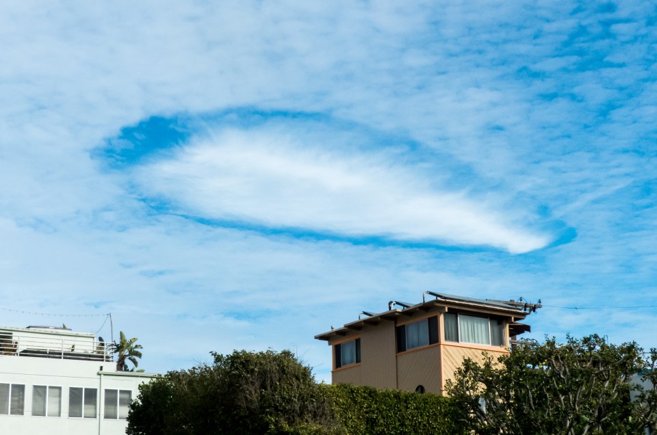 Beachgoers were stunned when this enormous cloud suddenly materialised in the sky in Huntington Beach, California, in the shape of a UFO in 2017