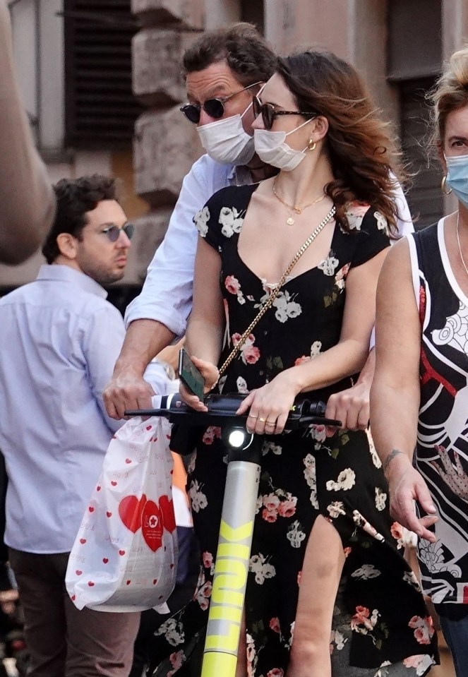 The pair got close as they shared an electric scooter to explore the city