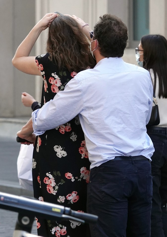 Dominic put his arms around Lily as he steered the two-wheeler