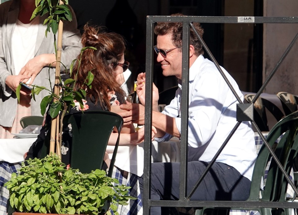 The pair beamed as they sat next to each other over lunch