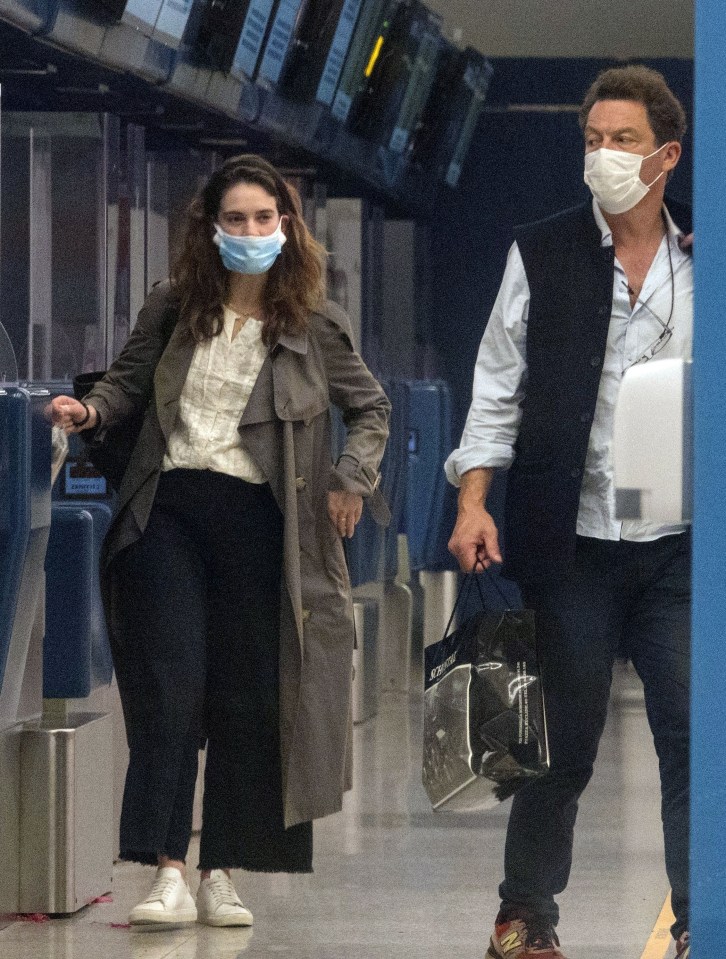 Dominic West and co-star Lily James were seen passionately kissing on a busy flight