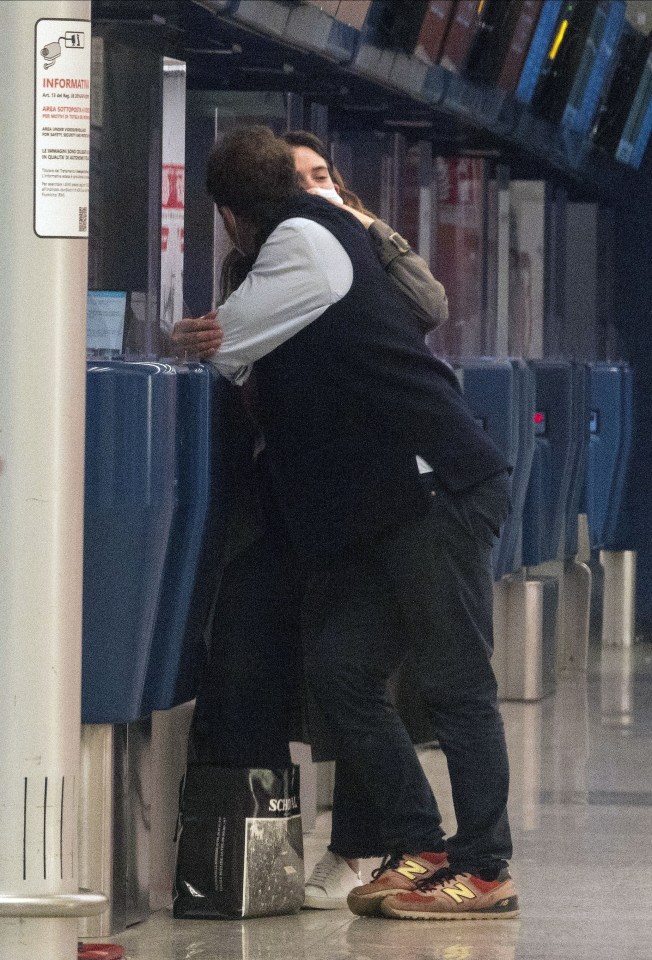 Married West and Lily snogged as they flew out to Rome