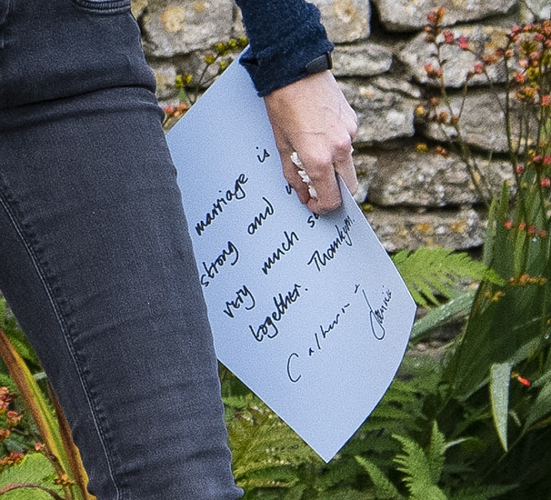 She was seen carrying a short handwritten statement signed by the couple