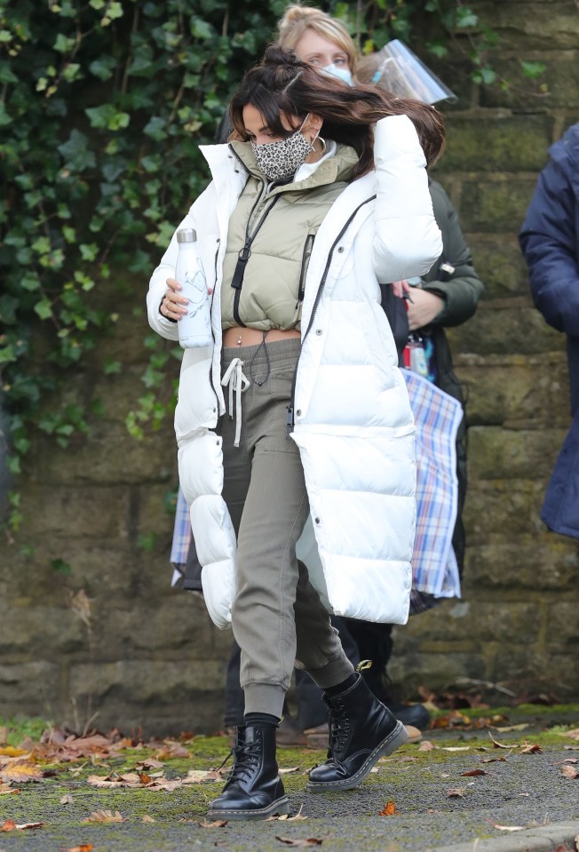 The actress covered her mouth with a leopard print face mask between takes 