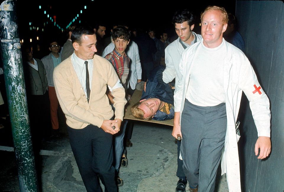 An injured protester being stretchered away from the chaotic riots