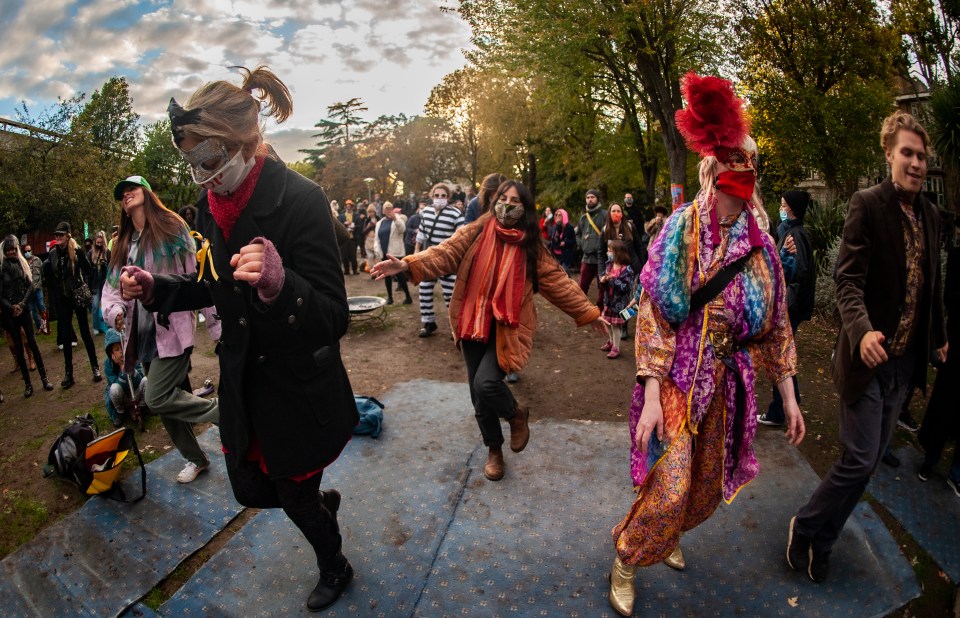 Revellers at the Anarchists' Carnival event in memory of Occupy Wall Street founder, David Graeber