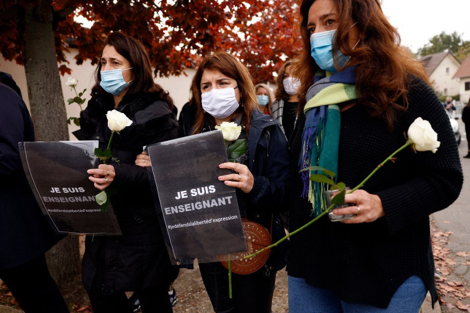 They held signs reading "Je Suis Enseignant" - meaning "I am a teacher"