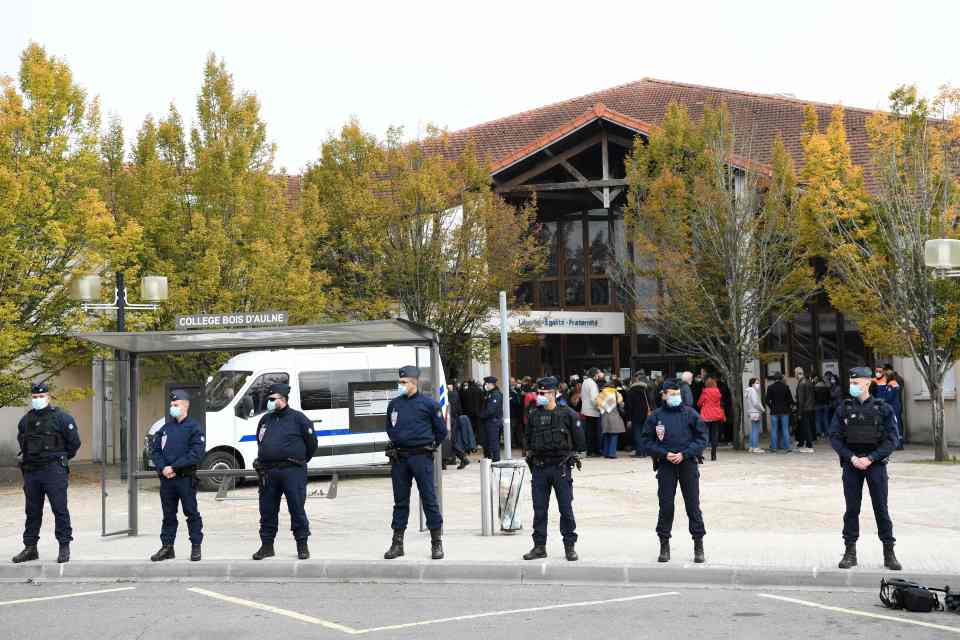 Police at the scene today as prosecutors confirmed the killing is being treated as terrorism