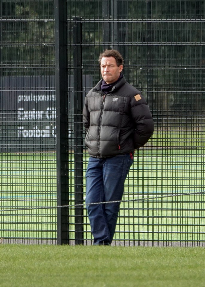 Dominic West was pictured watching his son playing football yesterday