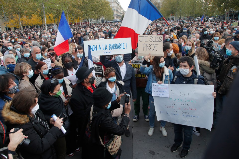 Placards among the crowds read 'No to barbarity' and 'I'm a. teacher' 