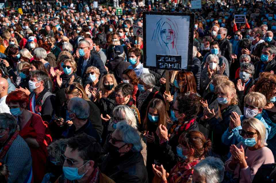 People wore masks as they demonstrated in the French capital