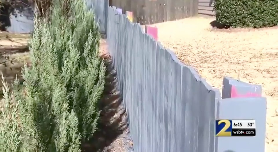 She kept the pretty grey shade on her side of the fence to match the trim of her house