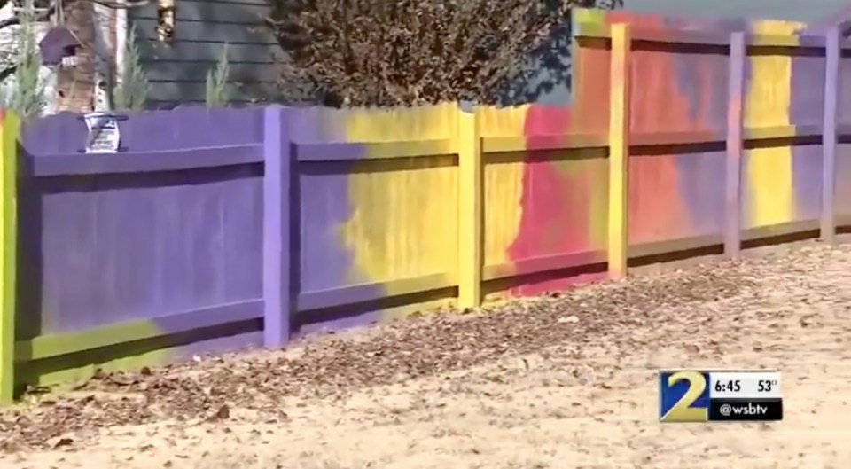 Donna Yopp Paul painted her fence in clashing colours to get revenge on her neighbours