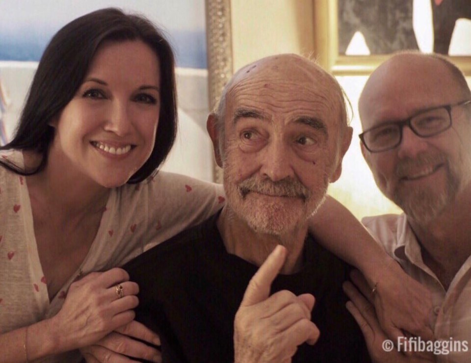The James Bond legend poses with his son and his son's partner on his 89th birthday