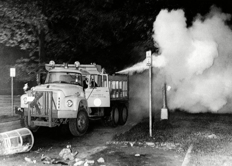 A truck spewing tear gas in a bid to force crowds assembled in Chicago's Grant Park to disperse