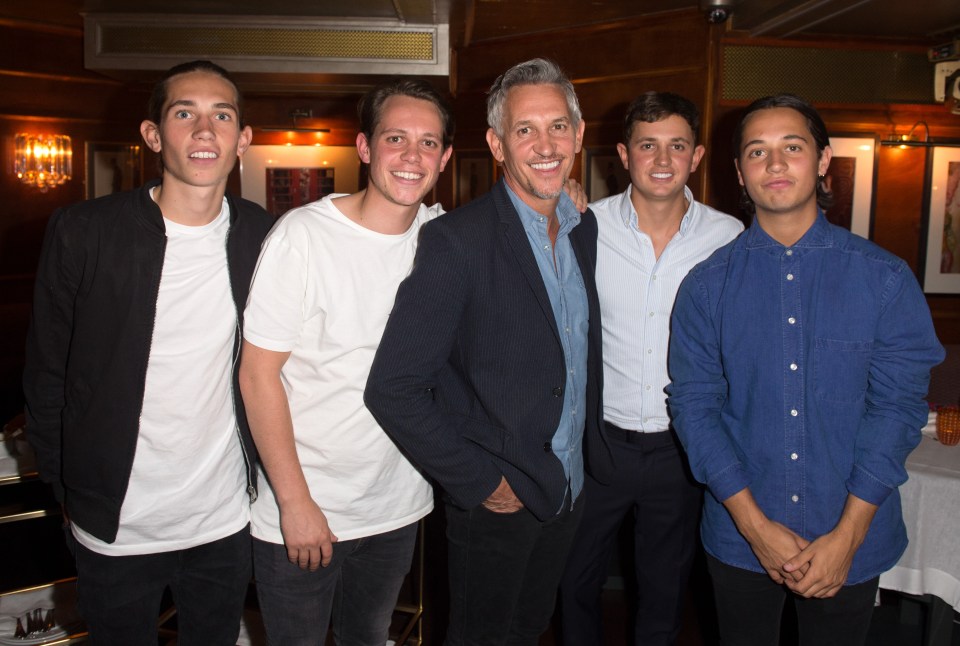 The proud dad with sons (from left) Angus, Harry, George and Tobias