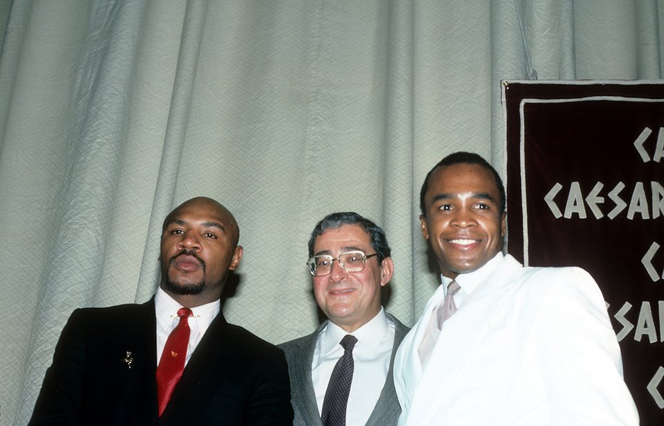 Marvin Hagler, left, pictured alongside Arum and Sugar Ray Leonard 
