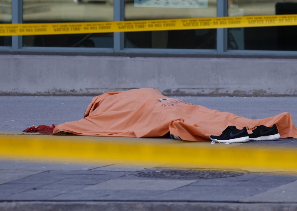 One of those killed lying underneath a cover 