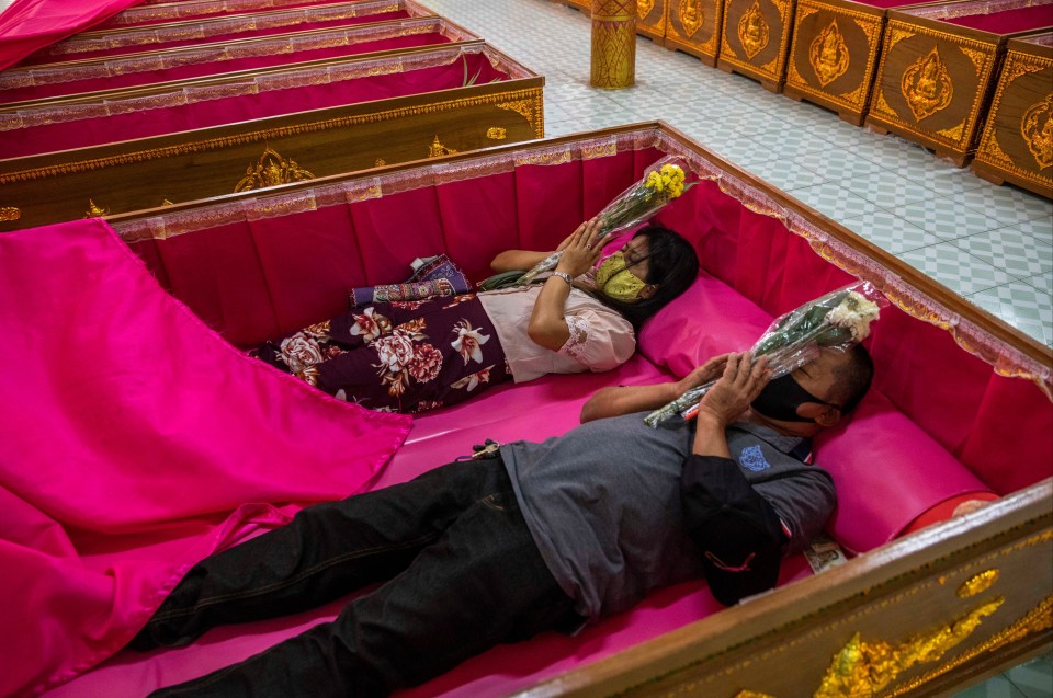 Thai devotees can be seen lying down for the resurrection ceremony, with bad karma being cleansed and blessings of good fortune welcomed 