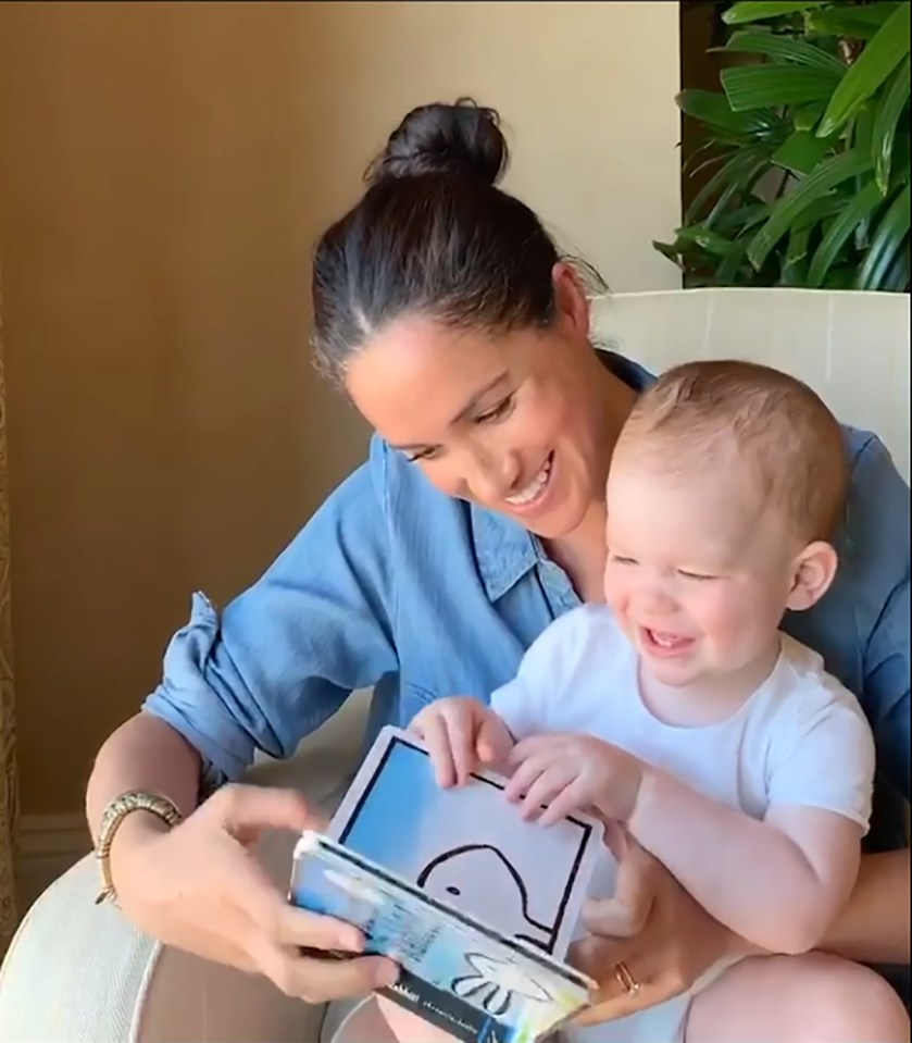 Markle was all smiles with beaming 1-year-old Archie whilst reading a book