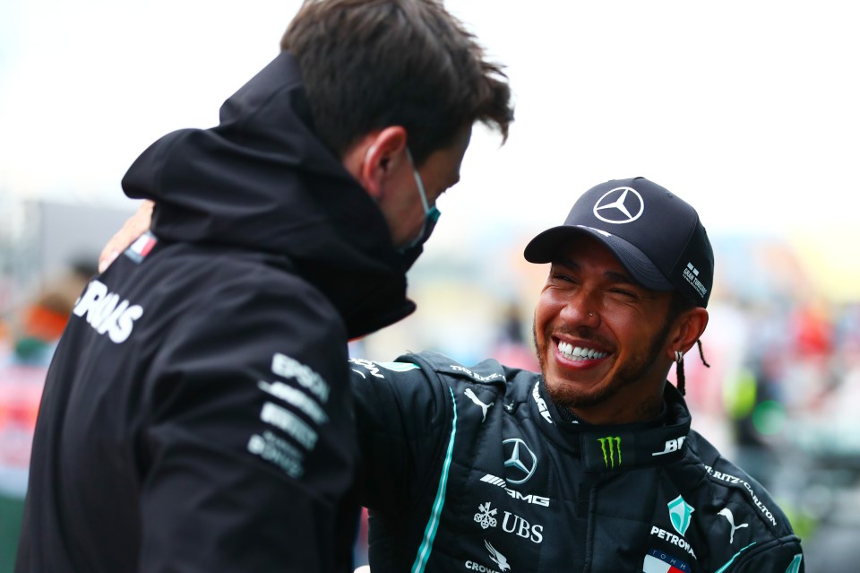 Toto Wolff and Lewis Hamilton celebrate his seventh world title